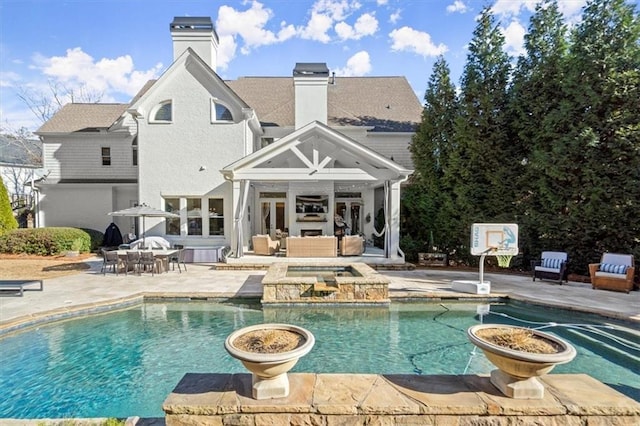 view of pool with an outdoor hangout area and a patio area