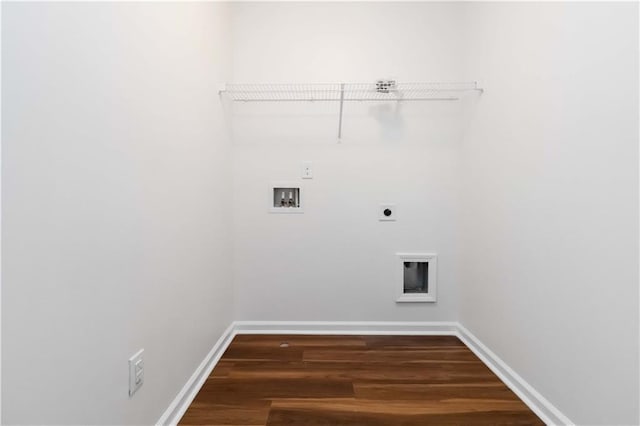 laundry room with electric dryer hookup, hookup for a washing machine, wood finished floors, and baseboards