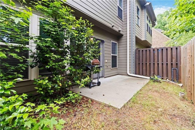 view of patio featuring fence