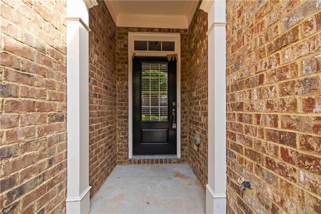 entrance to property with brick siding