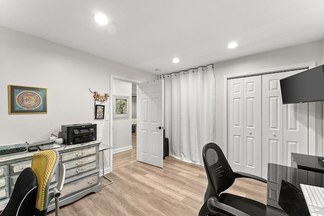 home office featuring light wood-style floors and recessed lighting