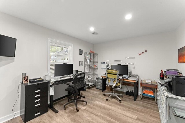 office with light wood-style flooring, recessed lighting, and baseboards