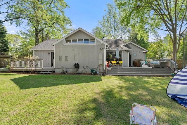 back of house with a deck, outdoor lounge area, and a shingled roof