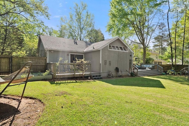 back of house with a deck