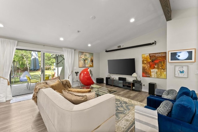 living area with lofted ceiling, wood finished floors, recessed lighting, and baseboards