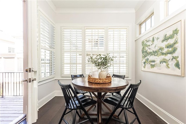 dining room featuring baseboards, dark wood-type flooring, and ornamental molding