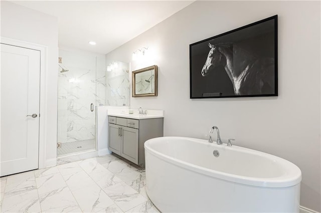 full bath with a marble finish shower, recessed lighting, a soaking tub, marble finish floor, and vanity