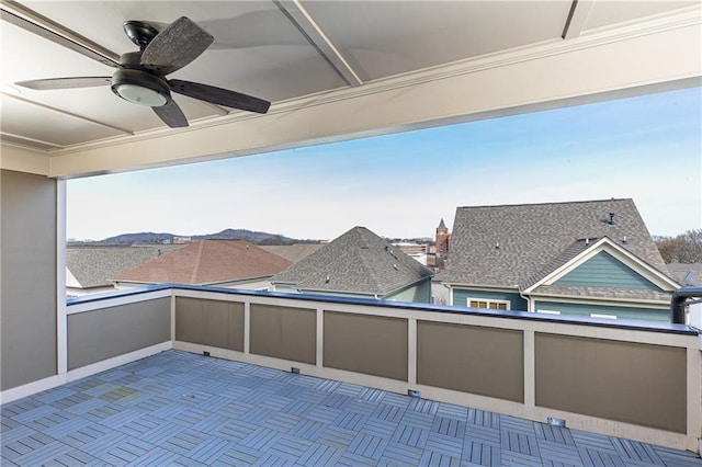 view of patio featuring a balcony and a ceiling fan