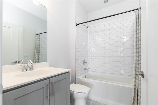 full bath with vanity, toilet, and shower / tub combo with curtain