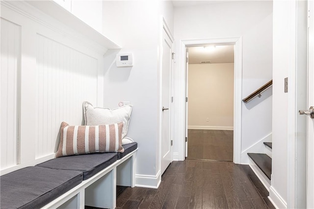 mudroom featuring baseboards and dark wood finished floors