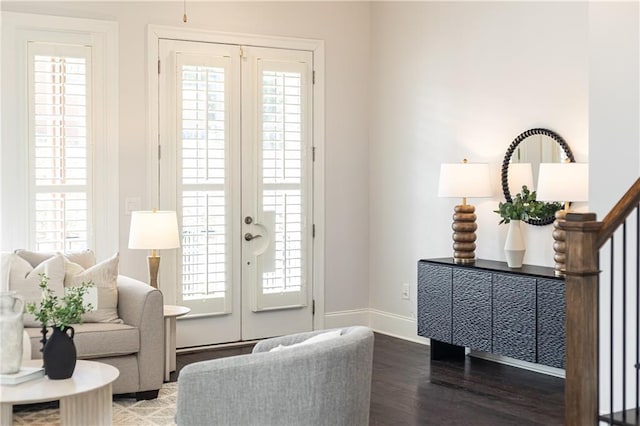 entryway with a wealth of natural light, french doors, stairs, and wood finished floors