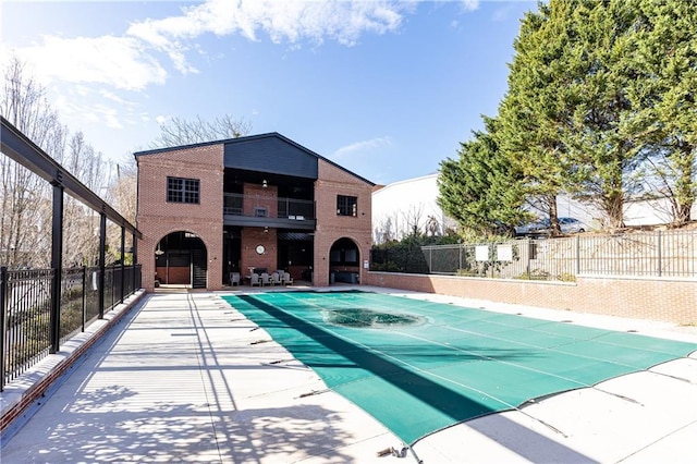 view of swimming pool featuring a fenced in pool, a patio, and fence