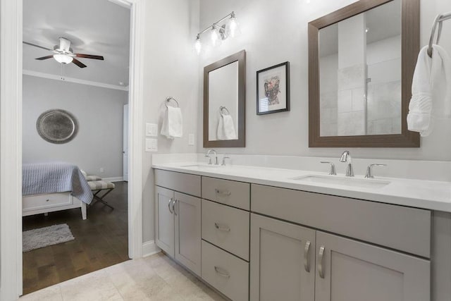 bathroom featuring vanity, crown molding, ceiling fan, and hardwood / wood-style flooring