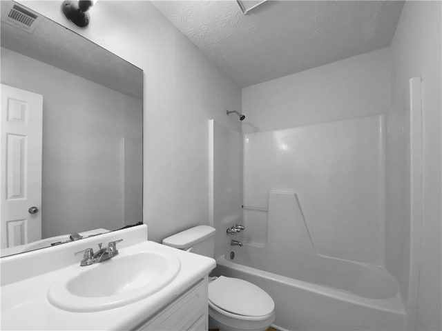 full bath featuring bathtub / shower combination, visible vents, toilet, vanity, and a textured ceiling