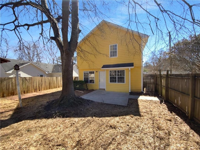 back of house with a patio and a fenced backyard