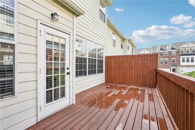 wooden terrace with a residential view