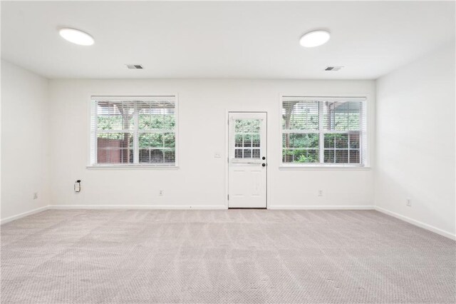 multi unit property with brick siding, a garage, and driveway