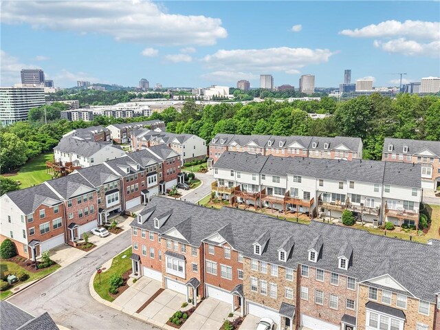 drone / aerial view featuring a view of trees