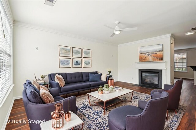 unfurnished dining area featuring baseboards, ornamental molding, dark wood finished floors, and a chandelier