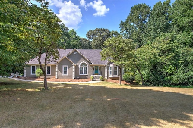 single story home with a front yard