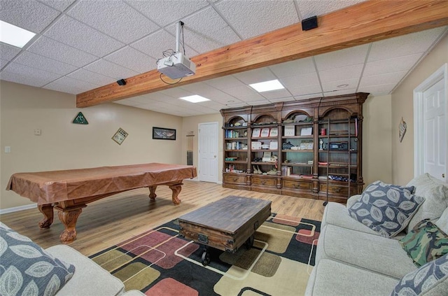 game room with a paneled ceiling, beam ceiling, wood-type flooring, and pool table