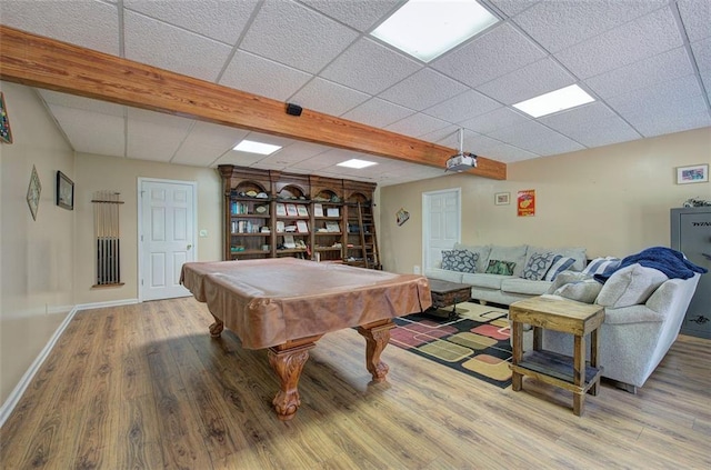 playroom with hardwood / wood-style flooring, a drop ceiling, beamed ceiling, and pool table