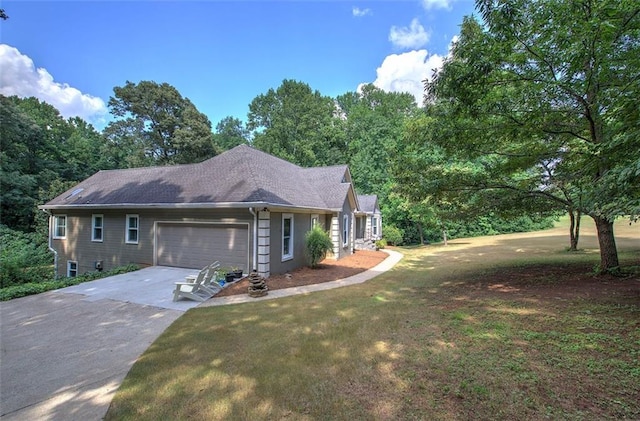 single story home featuring a garage and a front lawn