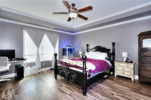 bedroom with ceiling fan, ornamental molding, and wood-type flooring