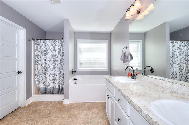 bathroom with vanity and independent shower and bath