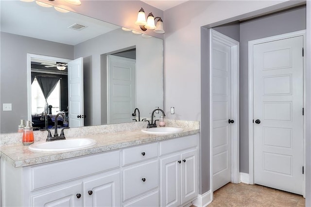 bathroom featuring vanity, tile patterned flooring, and ceiling fan