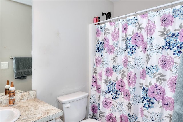 bathroom with vanity, a shower with curtain, and toilet