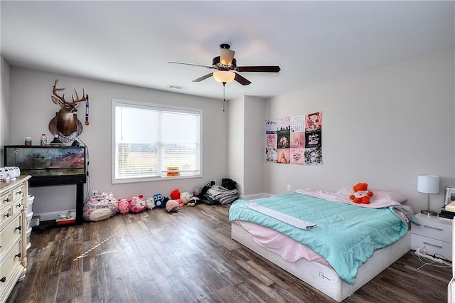 bedroom featuring dark wood-type flooring and ceiling fan