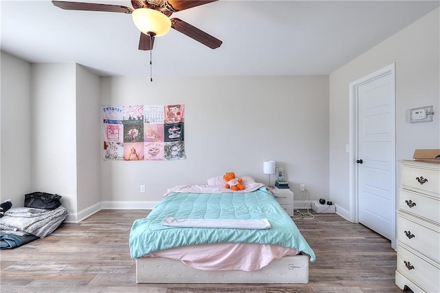 bedroom featuring light wood-type flooring and ceiling fan