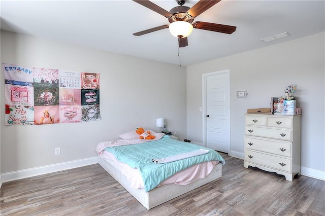 bedroom featuring wood-type flooring and ceiling fan