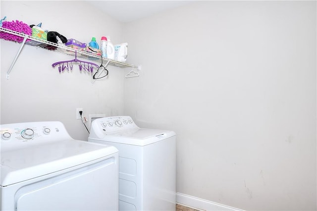 laundry area with washing machine and clothes dryer