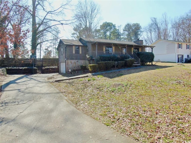 view of front of home with a front lawn and a porch