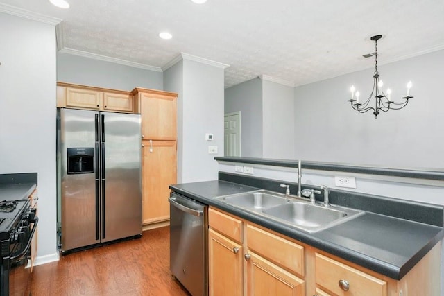 786 Brookside Parc Ln, Avondale Estates, GA 30002 - kitchen with appliances with stainless steel finishes, dark countertops, light brown cabinets, wood finished floors, and a chandelier