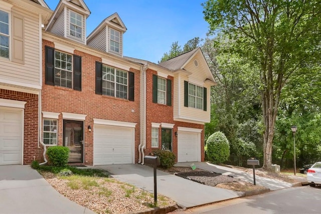 786 Brookside Parc Ln, Avondale Estates, GA 30002 - townhome / multi-family property featuring brick siding, driveway, and an attached garage