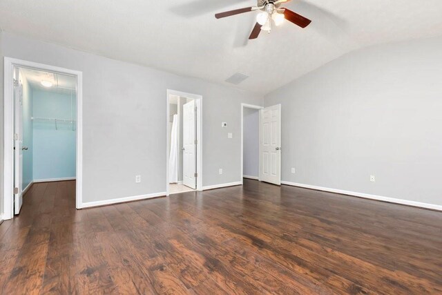 786 Brookside Parc Ln, Avondale Estates, GA 30002 - unfurnished bedroom featuring vaulted ceiling, a walk in closet, wood finished floors, ceiling fan, and attic access