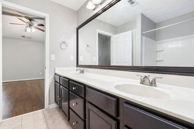 786 Brookside Parc Ln, Avondale Estates, GA 30002 - bathroom featuring ceiling fan, double vanity, and tile patterned flooring