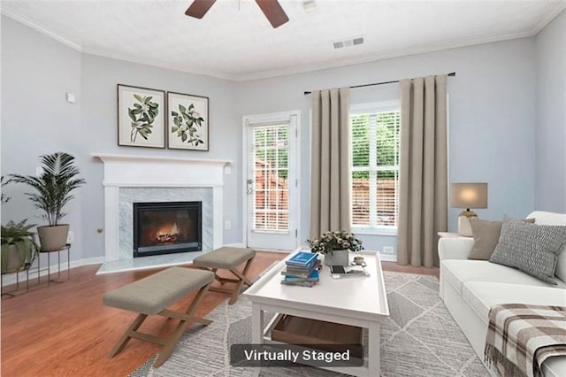 786 Brookside Parc Ln, Avondale Estates, GA 30002 - living room with a ceiling fan, a high end fireplace, wood finished floors, and ornamental molding