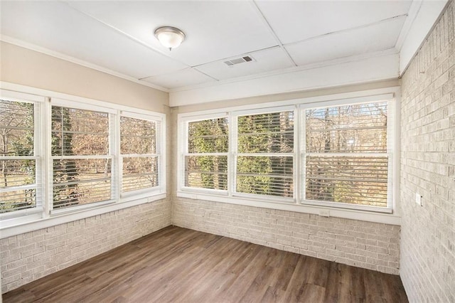 unfurnished sunroom with plenty of natural light