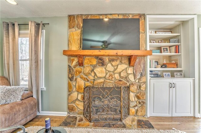 285 Skeet Shoot Rd, Dallas, GA 30132 - living area with wood finished floors, a fireplace, baseboards, and built in shelves