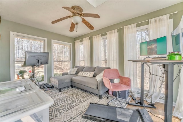 living room featuring a ceiling fan