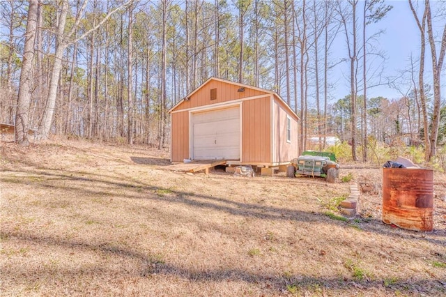 view of outbuilding featuring an outbuilding and driveway