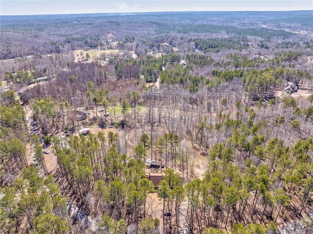 birds eye view of property with a wooded view