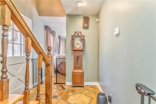 285 Skeet Shoot Rd, Dallas, GA 30132 - foyer featuring baseboards, stairway, light stone finish floors, and a textured ceiling