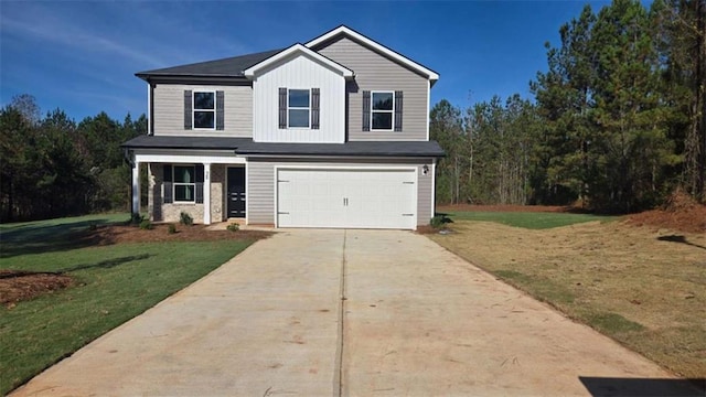 view of front of house featuring a front yard and a garage