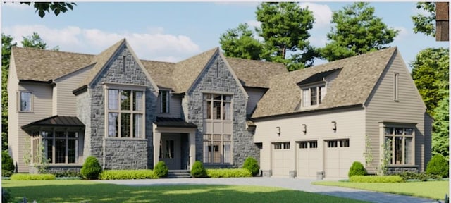 view of front of house featuring a garage and a front yard