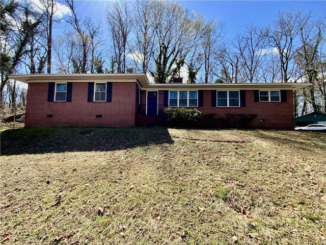 ranch-style house with crawl space, brick siding, and a front lawn